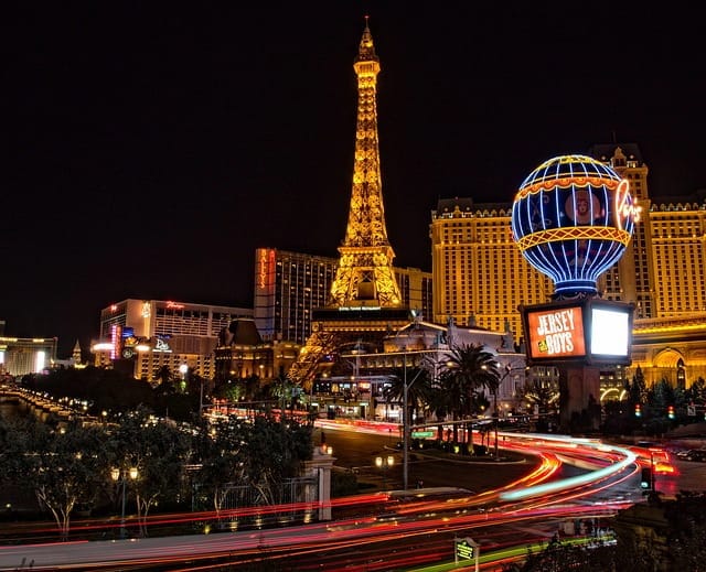 Nighttime view of the Las Vegas strip with Paris Hotel in the background, embodying the glowing reputation of Hansen & Harmon Injury Law as a premier Las Vegas Injury Law firm for all types of personal injury cases