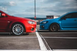 Two cars facing each other. Who is at fault in a car accident.